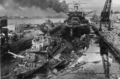Unforgettable Pearl Harbor Aftermath: The Charred Hulks of Destroyers USS Downes and USS Cassin in Drydock One, December 7, 1941 — Nearly Reduced to Scrap by Japanese Bombs and Fires, Yet Against All Odds Both Vessels Were Painstakingly Rebuilt and Later Returned to Active Combat Service in WWII.