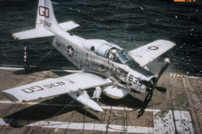 EA-1E Skyraider (BuNo 139562) from Carrier Airborne Early Warning Squadron VAW-33 Det.39 “Night Hawks” hitting the barrier after missing the arresting wires aboard the last straight deck carrier in the U.S. Navy, USS Lake Champlain (CVS-39), September 19, 1964.