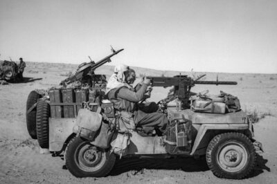 SAS Jeep in 1943 Tunisia: A Heavily Armed Vehicle Loaded with Fuel, Water, and Gear – A .50 Inch Browning MG on the Gunner, and Vickers ‘K’ Guns Ready for Combat in Front and Behind!