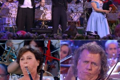 Under the golden glow of the stage lights, André Rieu leads his orchestra into the first stirring notes of Highland Cathedral, and the entire audience seems to hold its breath. The haunting melody of the bagpipes rises like a prayer, weaving through the strings with a grace that feels almost otherworldly. Faces in the crowd soften, eyes glisten, and hands clasp as the music swells—uniting strangers in a shared, unspoken emotion. In that moment, time stands still, and the hall is filled with something deeper than music… it’s pure, unforgettable magic.