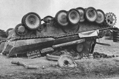 An upside down Panther A in Normandy 1944. Now, what has the force to flip such a lump of steel? Aerial or naval shells?
