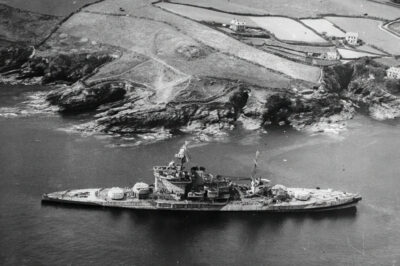 Whilst the Warspite was being towed for breaking up the tow cables broke and she ran aground off Prussia Cove, Cornwall on March 23, 1947. Note the absence of any armament, which had already been removed. The ship was later dismantled on site.