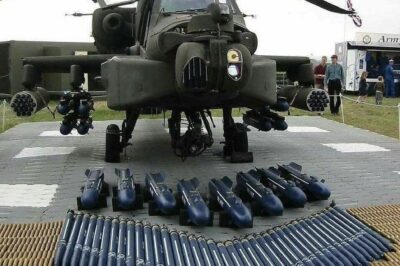 Helicopter Progress: Loading 30mm chain gun onto an AH-64 Apache