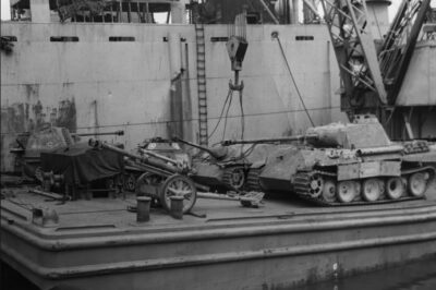 Panther Ausf. A, Jagdpanzer IV and Marder III Ausf. M among captured German equipment loaded on a Barge in Italy in September 1944