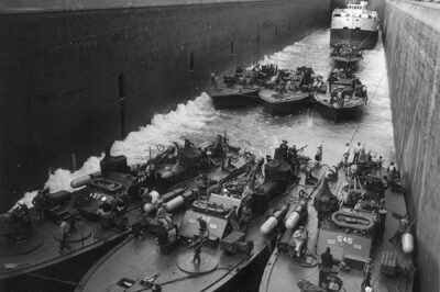 A plethora of PT Boats, PT-487, PT-486, PT-545 in the Welland Canal, along with four unidentified PT boats and an Ore Carrier, Oct 1945