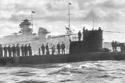 U-47 passing battleship Scharnhorst on return to port after sinking British battleship HMS Royal Oak in Scapa Flow, October 1939.