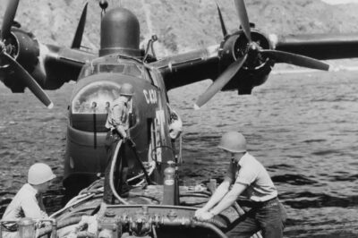 A Martin PBM-5 Mariner of Fleet Air Wing One takes on fuel from a small bowser boat in Tanapag Harbor, Saipan, May 1945. These seaplanes required specialized support vessels to keep them operational. Such refueling operations were routine in forward island bases during the Pacific campaign.