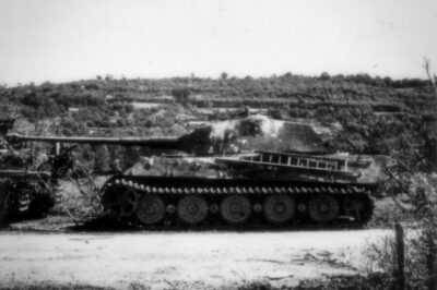 Tiger II heavy tank abandoned near Vimoutiers, Normandy, France, June–July 1944. The Tiger II, or Königstiger, was the most heavily armored tank of WWII.