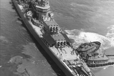 USS Canberra (CA-70) Baltimore-class heavy cruiser (later…Boston-class guided missile cruiser) moving into position for the International Naval Review in Hampton Roads, VA on June 12, 1957.