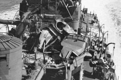 The Shocking Aftermath of the USS Nicholas (DD-449) Gun Mount Explosion: A Narrow Escape!  On May 13, 1943, during shelling operations off Kilombangara, the #3 5″ gun mount aboard the USS Nicholas (DD-449) suffered a devastating hang-fire, causing an explosion inside the chamber. Miraculously, the gun crew evacuated just in time, avoiding casualties. The destroyer retired to Nouméa, where her damaged gun mount was replaced with one from the USS Hutchins (DD-476), which had just returned from a convoy escort mission. This swift action saved time and kept the Nicholas operational while Hutchins returned to Hawaii for a refit.