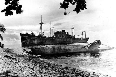 Japanese Type A Ko-hyoteki midget submarine and transport Yamazuki Maru beached on Guadalcanal, Solomon Islands, 1 May 1944.